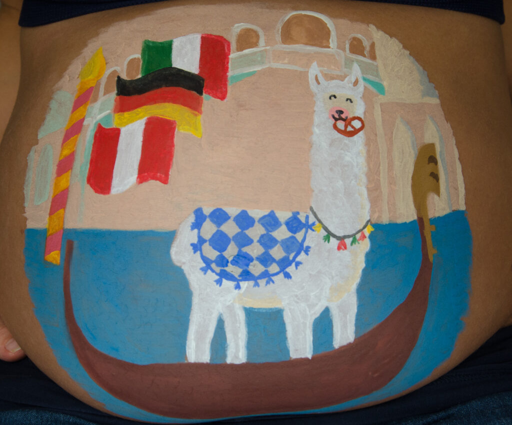 Lama decorated with necklace and eating a pretzel